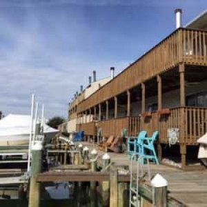 dock with boats and condominium